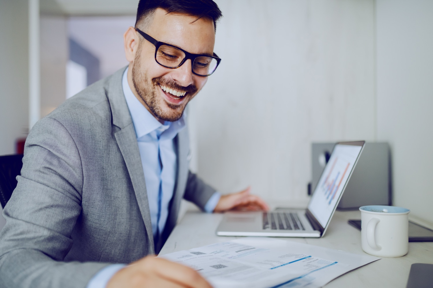 Business owner reviewing accounts receivable and cash-flow reports
